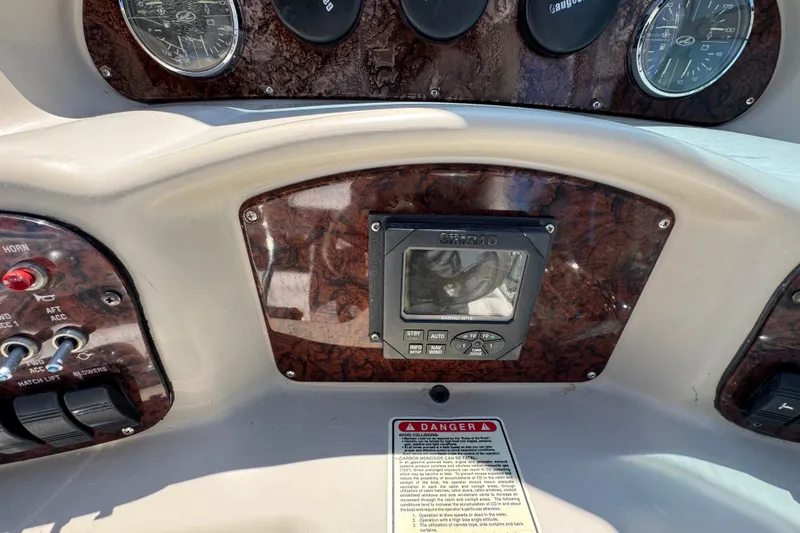Slide: The Image of Control panel of a 2006 Sea Ray 340 Sundancer boat with gauges and switches. - 40