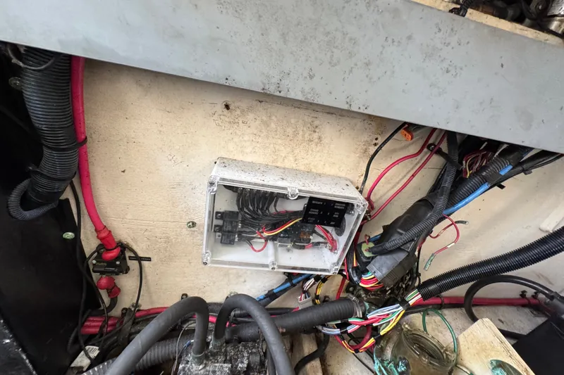 Slide: The Image of Electrical wiring and fuse box inside a 2006 Sea Ray 340 Sundancer boat. - 108