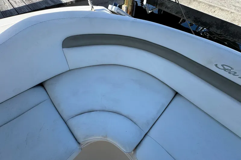 Slide: The Image of 2006 Sea Ray 340 Sundancer boat seating area with white and gray upholstery. - 20