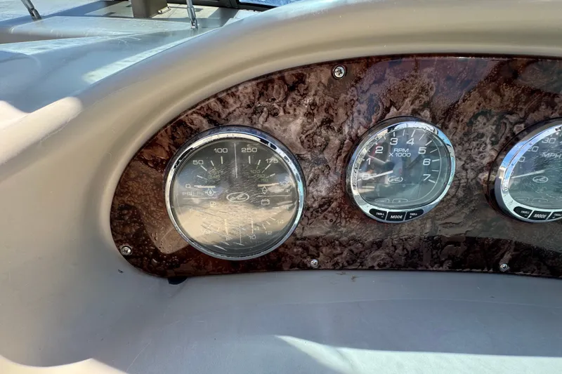 Slide: The Image of Dashboard gauges of a 2006 Sea Ray 340 Sundancer boat. - 47