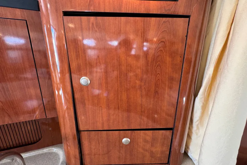 Slide: The Image of Wooden cabinet interior of 2006 Sea Ray 340 Sundancer yacht. - 91