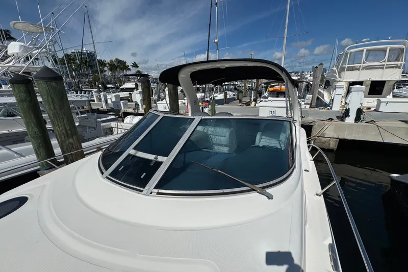 Slide: The Image of 2006 Sea Ray 340 Sundancer docked at marina under clear blue sky. - 57