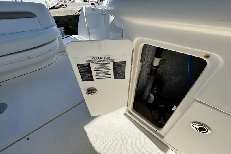 Slide: The Image of Open storage compartment on a 2006 Sea Ray 340 Sundancer boat deck. - 28