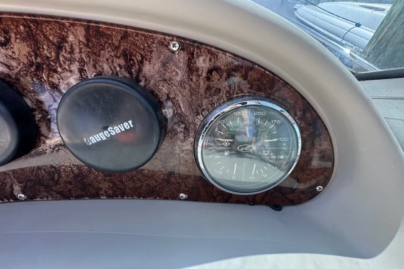 Slide: The Image of Dashboard of a 2006 Sea Ray 340 Sundancer boat with gauges and wood finish. - 45