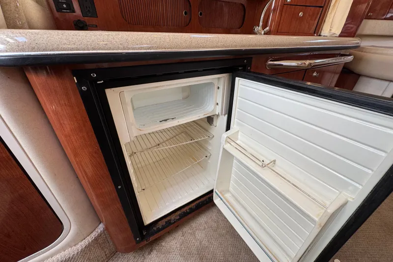 Slide: The Image of Open refrigerator in 2006 Sea Ray 340 Sundancer yacht interior. - 94