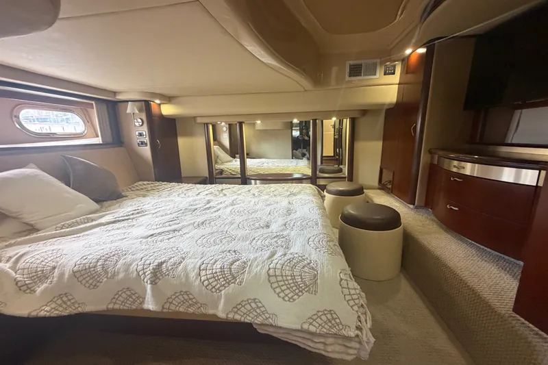 Slide: The Image of Luxurious 2006 Sea Ray 550 Sedan Bridge bedroom with elegant decor and ample natural light. - 74