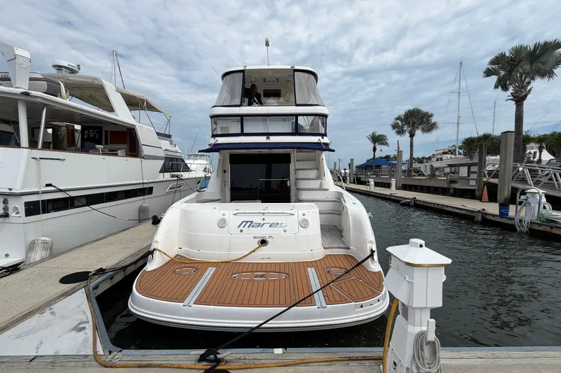 Slide: The Image of 2006 Sea Ray 550 Sedan Bridge yacht docked at marina, rear view. - 41