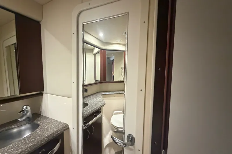Slide: The Image of Luxurious bathroom interior of 2006 Sea Ray 550 Sedan Bridge yacht, featuring modern fixtures. - 105