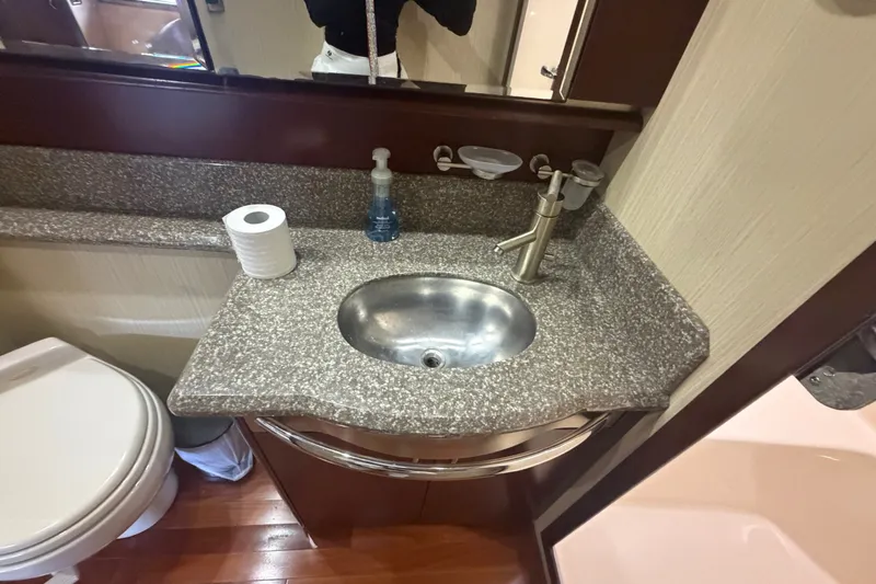 Slide: The Image of Luxurious bathroom sink area on a 2006 Sea Ray 550 Sedan Bridge yacht. - 83