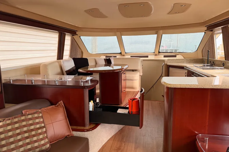 Slide: The Image of Luxurious interior of a 2006 Sea Ray 550 Sedan Bridge yacht with elegant furnishings. - 106