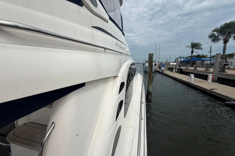 Slide: The Image of 2006 Sea Ray 550 Sedan Bridge yacht docked at marina, side view. - 39