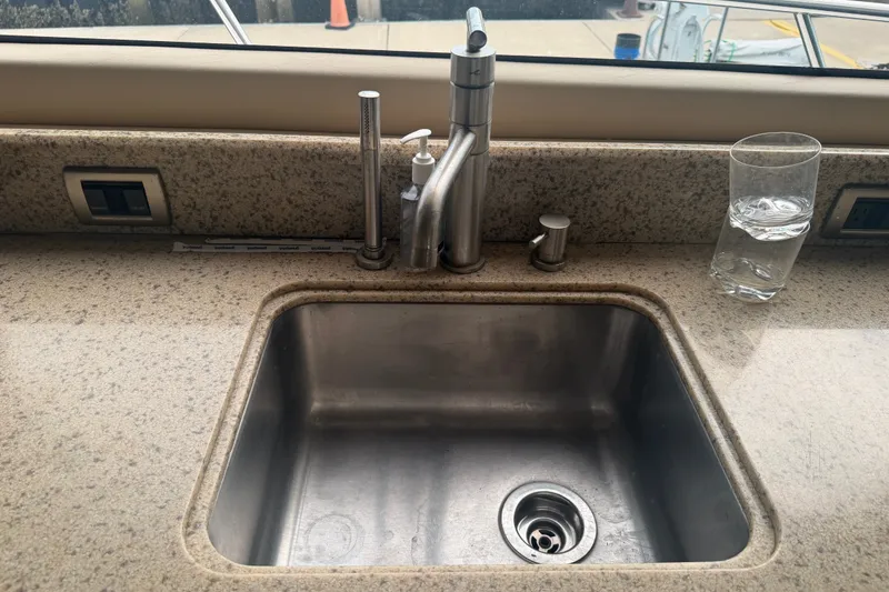 Slide: The Image of Stainless steel sink on 2006 Sea Ray 550 Sedan Bridge yacht with granite countertop. - 65