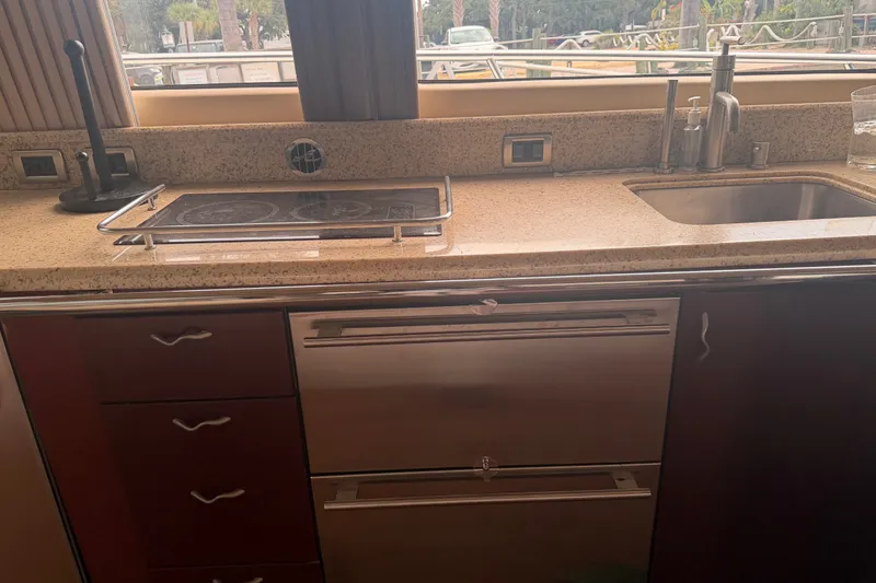 Slide: The Image of Luxurious kitchen area in a 2006 Sea Ray 550 Sedan Bridge yacht. - 72