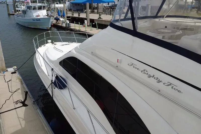 Slide: The Image of 2006 Sea Ray 550 Sedan Bridge yacht docked at marina. - 24
