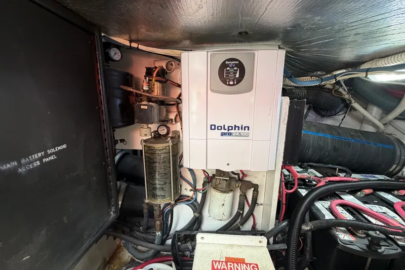 Slide: The Image of Engine room of 2006 Sea Ray 550 Sedan Bridge with Dolphin Pro 24.100 charger. - 149