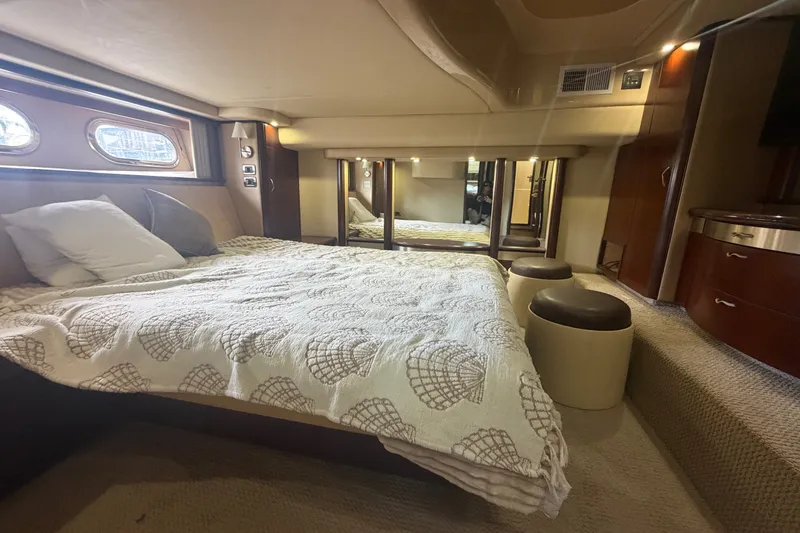 Slide: The Image of Luxurious bedroom interior of 2006 Sea Ray 550 Sedan Bridge yacht with elegant decor. - 75