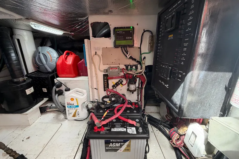 Slide: The Image of Engine room of 2006 Sea Ray 550 Sedan Bridge with battery and control panel. - 148