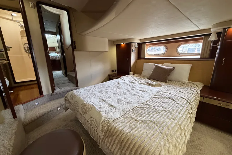 Slide: The Image of Luxurious bedroom interior of 2006 Sea Ray 550 Sedan Bridge yacht. - 118