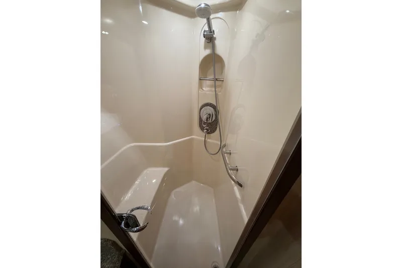 Slide: The Image of Luxurious shower in 2006 Sea Ray 550 Sedan Bridge yacht, featuring sleek design and modern fixtures. - 117