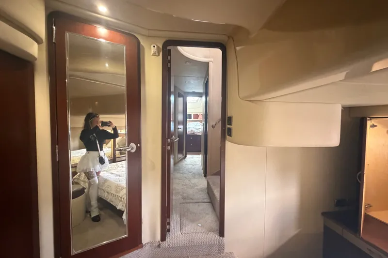 Slide: The Image of Interior of 2006 Sea Ray 550 Sedan Bridge yacht with mirrored door and cozy cabin. - 92