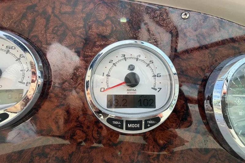 Slide: The Image of Dashboard of a 2006 Sea Ray Sundancer 320 showing RPM gauge and hours. - 56