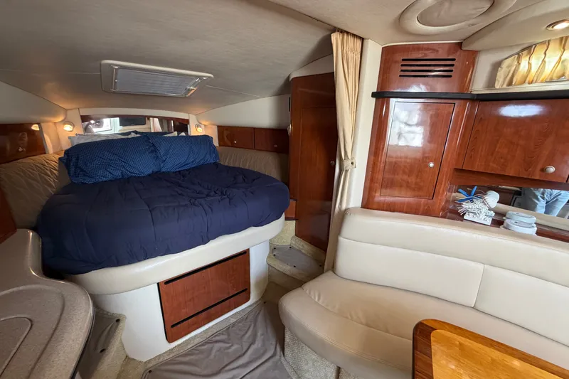 Slide: The Image of Interior of 2006 Sea Ray Sundancer 320 with cozy bed and elegant wood cabinetry. - 86