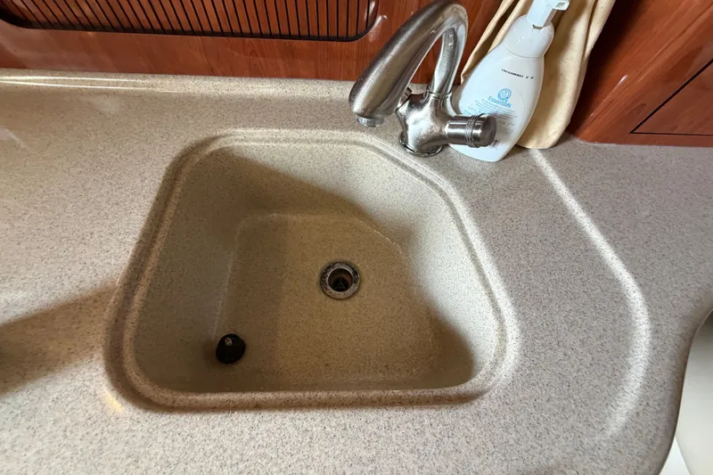 Slide: The Image of Kitchen sink and faucet in 2006 Sea Ray Sundancer 320 yacht interior. - 96