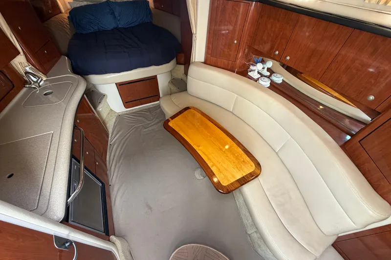 Slide: The Image of Luxurious interior of 2006 Sea Ray Sundancer 320 yacht with cozy seating and elegant wood finishes. - 78