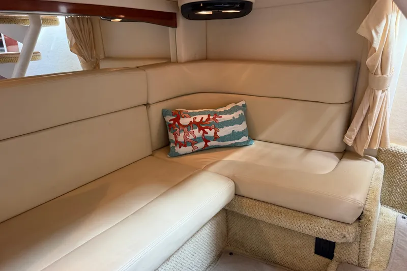 Slide: The Image of Interior of 2006 Sea Ray Sundancer 320 with beige seating and decorative pillow. - 92