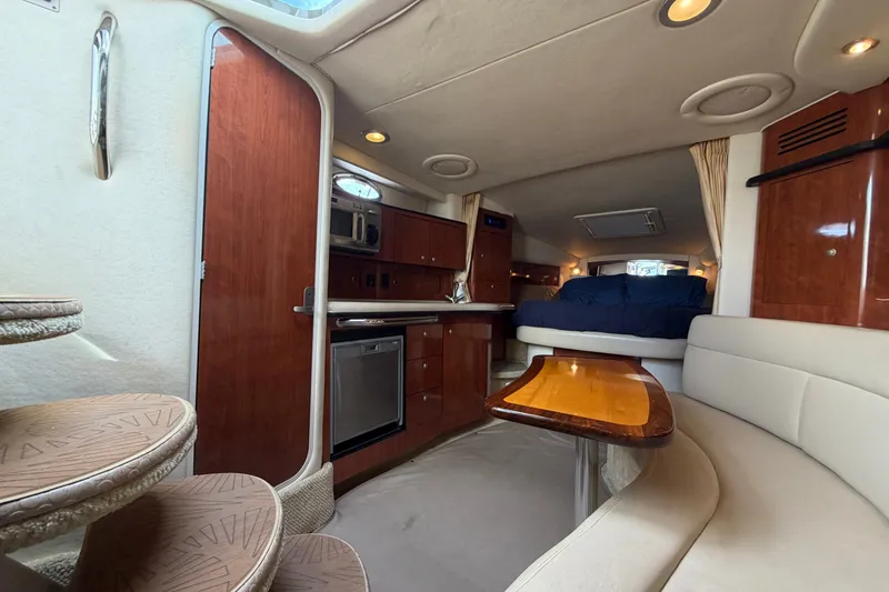 Slide: The Image of Interior of 2006 Sea Ray Sundancer 320 yacht with cozy seating and wooden finishes. - 87