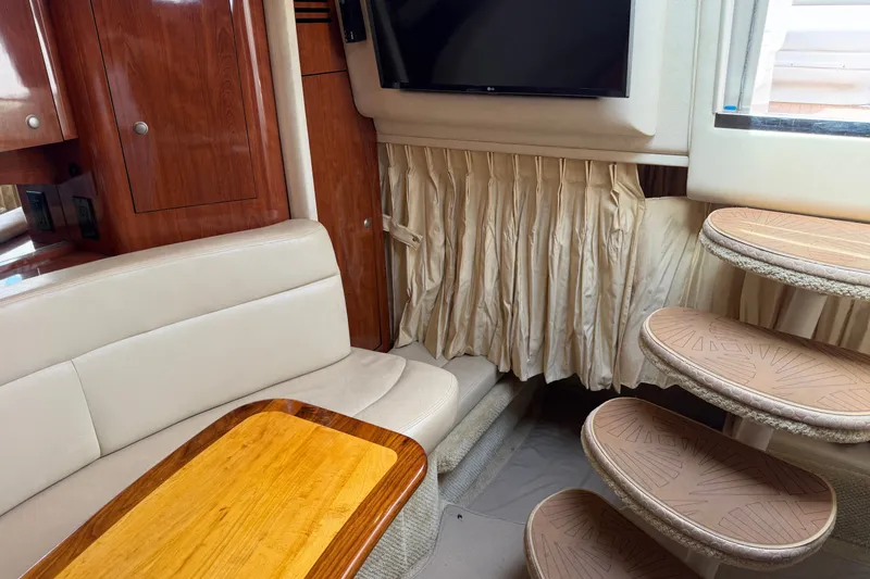 Slide: The Image of Interior of 2006 Sea Ray Sundancer 320 with seating, table, and stairs. - 90