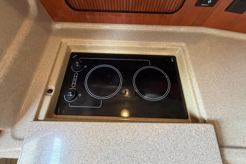 Slide: The Image of Built-in stovetop on 2006 Sea Ray Sundancer 320 yacht, featuring a sleek, modern design. - 95