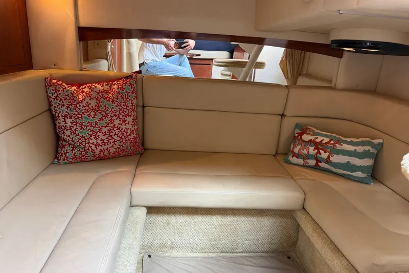 Slide: The Image of Interior of 2006 Sea Ray Sundancer 320 with beige seating and decorative pillows. - 74