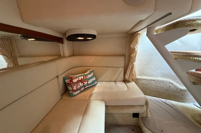 Slide: The Image of Interior of 2006 Sea Ray Sundancer 320 with beige seating and decorative pillow. - 94