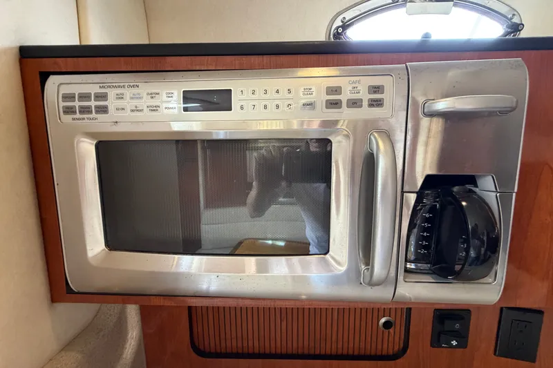 Slide: The Image of Microwave and coffee maker in 2006 Sea Ray Sundancer 320 yacht kitchen. - 71