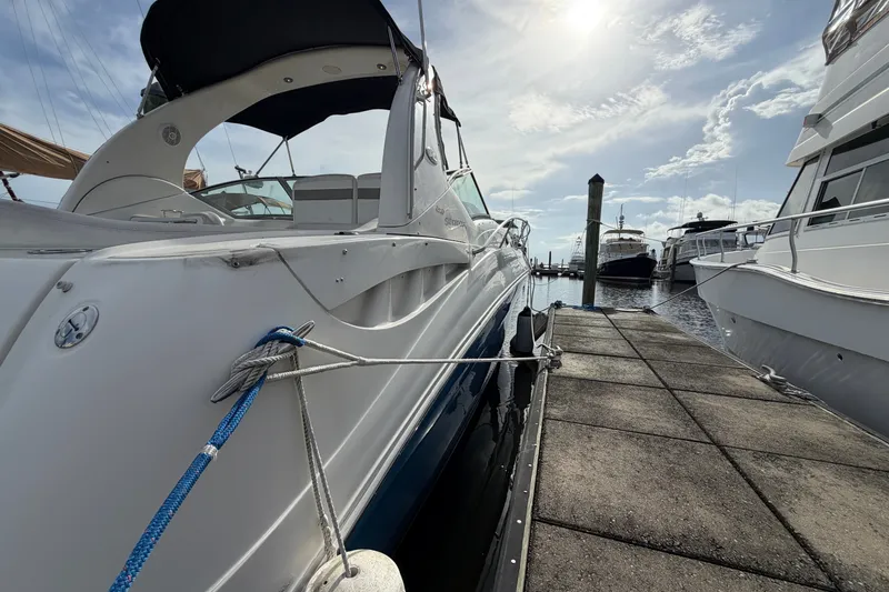 Slide: The Image of 2006 Sea Ray Sundancer 320 docked at marina under sunny sky. - 28