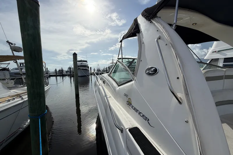 Slide: The Image of 2006 Sea Ray Sundancer 320 docked at marina under sunny sky. - 55