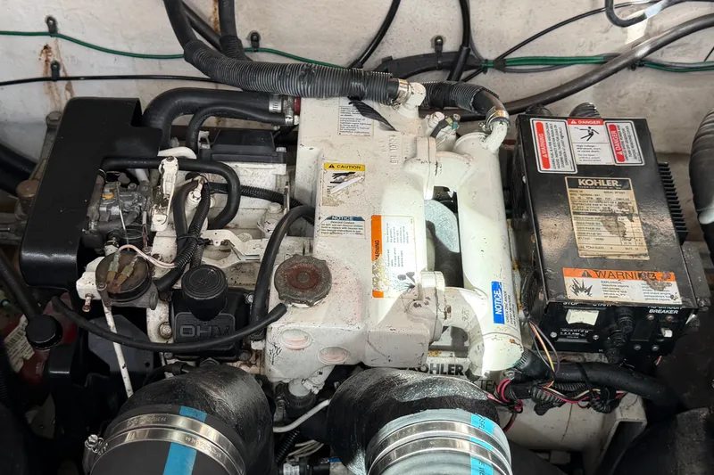 Slide: The Image of Engine compartment of a 2006 Sea Ray Sundancer 320 with Kohler generator. - 97