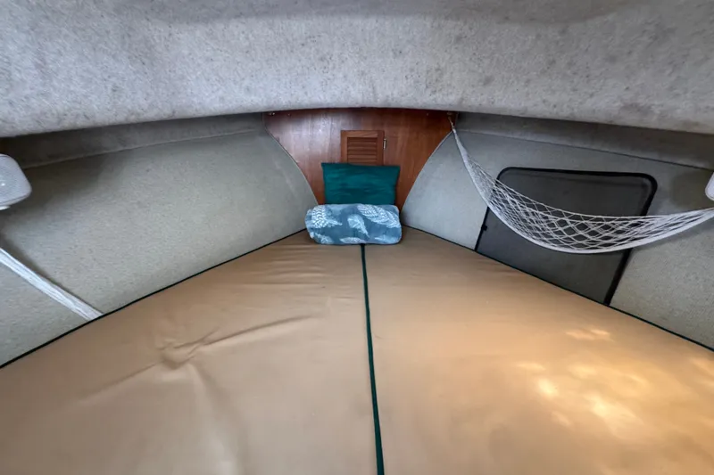 Slide: The Image of Cozy cabin interior of 2005 Atlas Boat Works Acadia 25 with cushions and netting. - 33