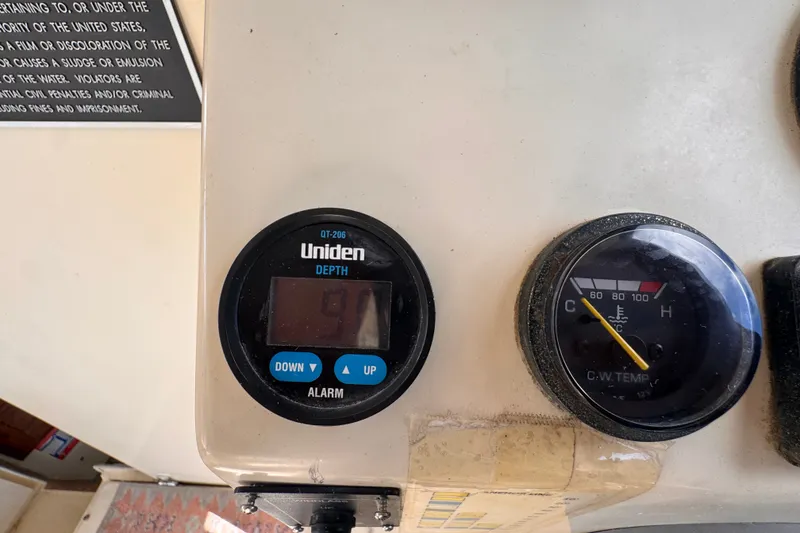 Slide: The Image of Control panel of 2005 Atlas Boat Works Acadia 25 with depth and temperature gauges. - 19