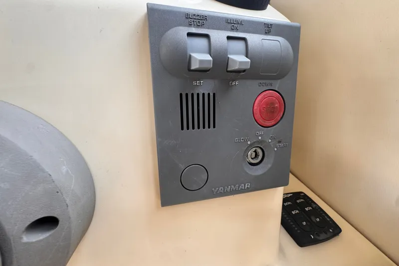 Slide: The Image of Control panel of a 2005 Atlas Boat Works Acadia 25 with Yanmar engine controls. - 23