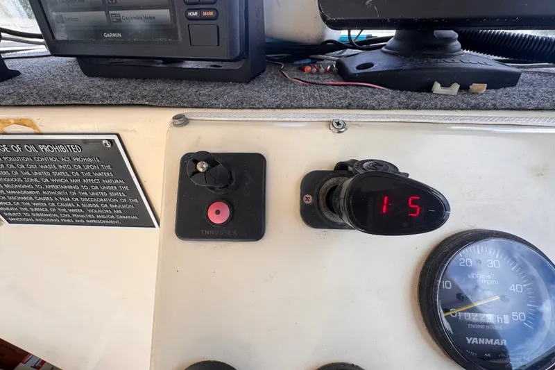 Slide: The Image of Control panel of a 2005 Atlas Boat Works Acadia 25 with digital display and gauges. - 21