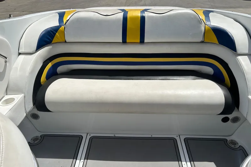 Slide: The Image of 2005 Baha Cruisers 302 boat interior with colorful seating and cup holder. - 66