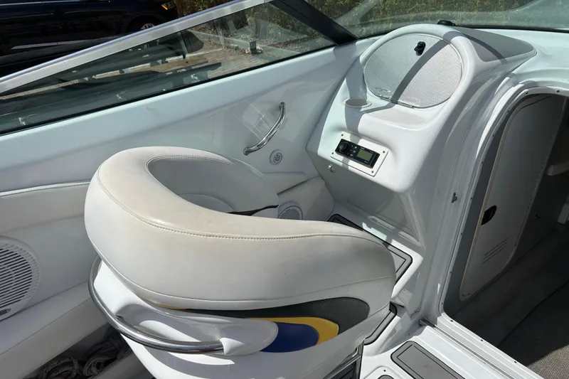 Slide: The Image of 2005 Baha Cruisers 302 boat interior with helm seat and control panel. - 22
