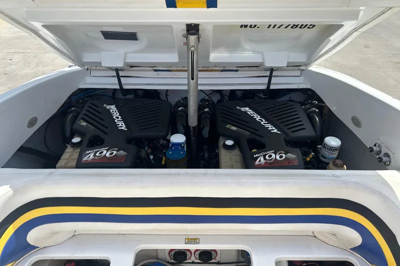 Slide: The Image of 2005 Baha Cruisers 302 boat engine compartment with twin Mercury MerCruiser 496 MAG engines. - 72