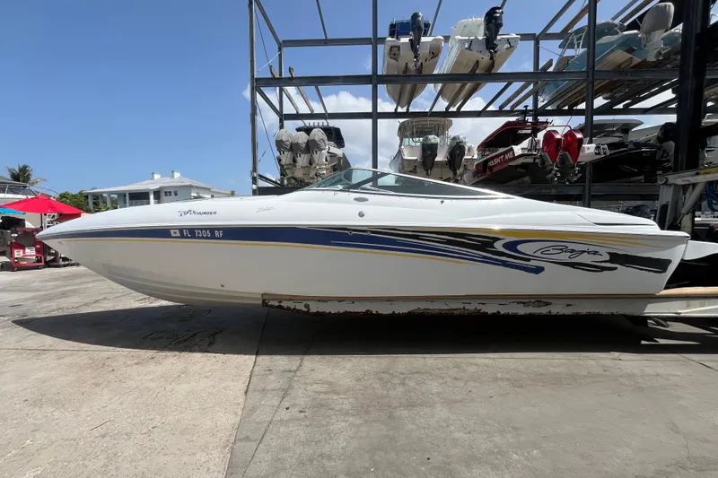 The Image of 2005 Baha Cruisers 302 boat on dry dock, featuring sleek design and vibrant graphics. - 0