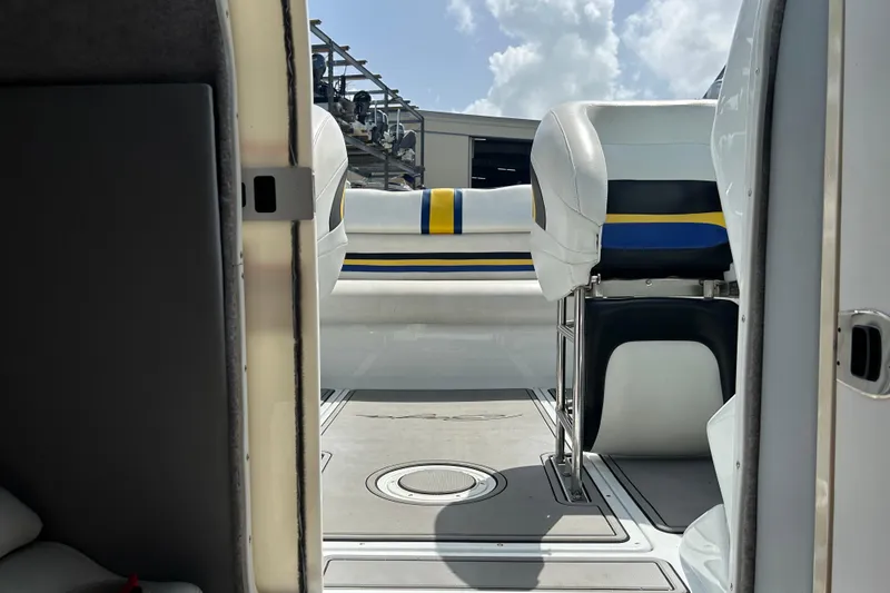 Slide: The Image of Interior view of 2005 Baha Cruisers 302 boat with seating and open hatch. - 59