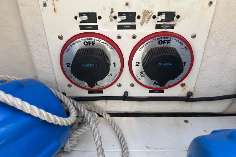 Slide: The Image of Control panel of a 2005 Baha Cruisers 302 boat with switches and ropes. - 70