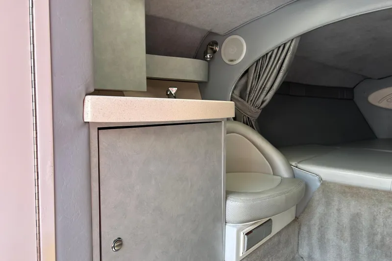 Slide: The Image of Interior of 2005 Baha Cruisers 302 boat, featuring seating and storage area. - 49