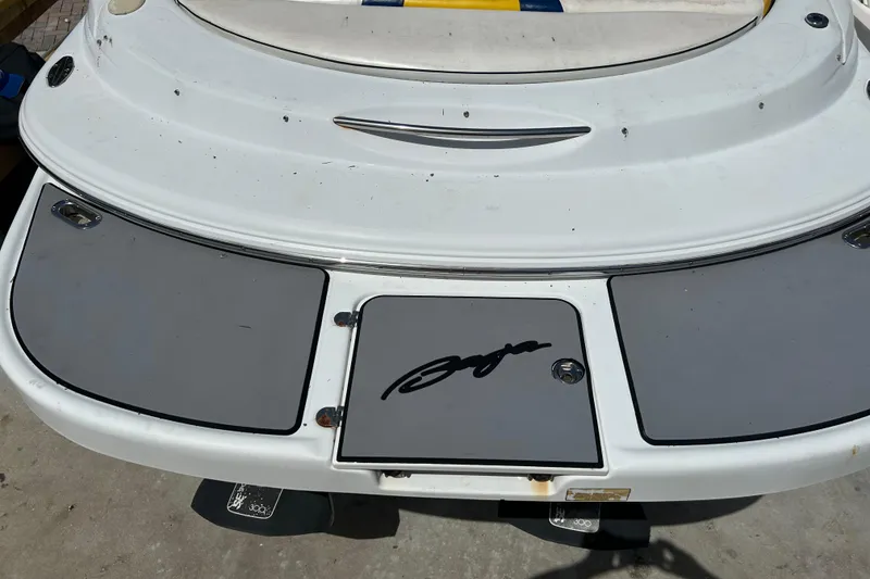 Slide: The Image of Rear view of 2005 Baha Cruisers 302 boat with logo on deck. - 76
